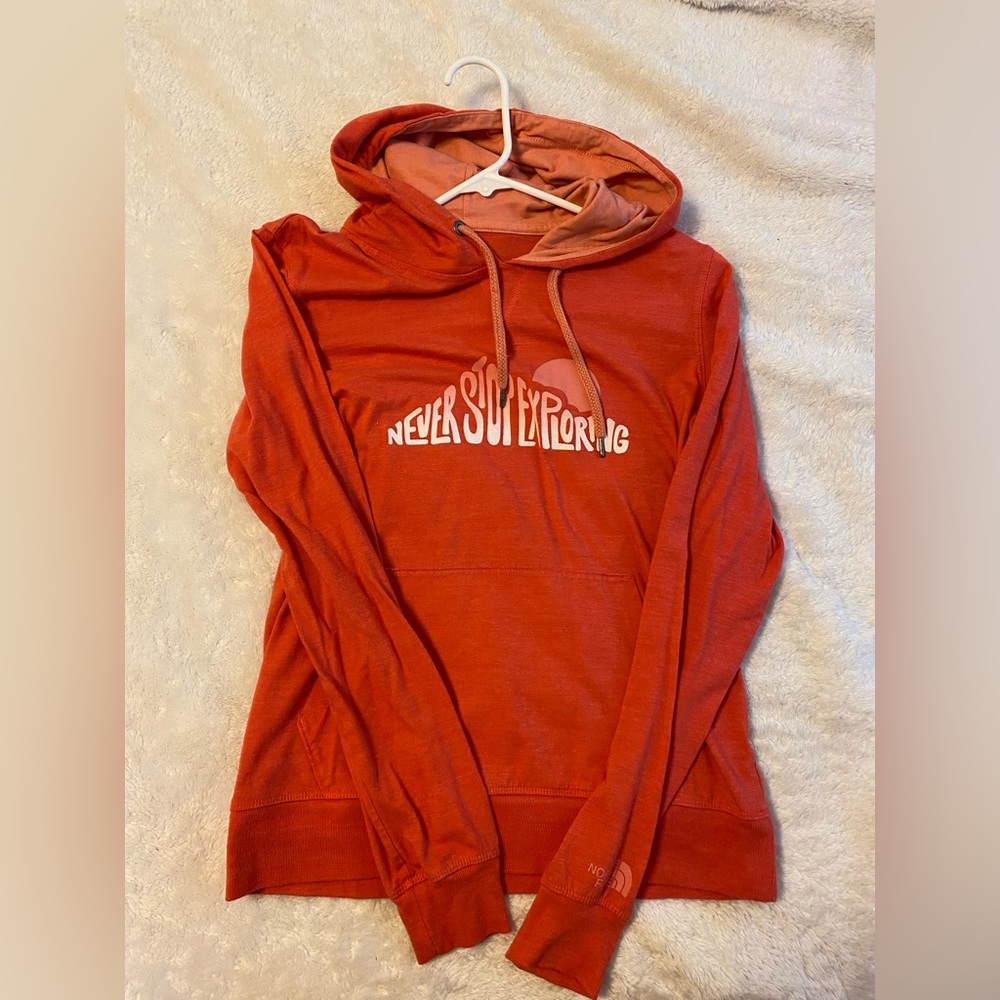 The North Face “Never Stop Exploring” light hoodie